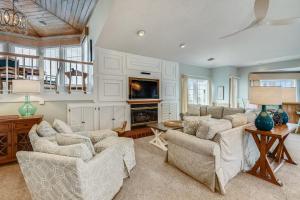 a living room with two couches and a fireplace at The Tappan at Ships Watch in Duck