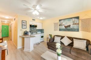 a living room with a couch and a kitchen at Beachfront Corpus Christi Condo with Pool Access! in Corpus Christi