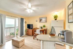 a kitchen and living room with a view of the ocean at Beachfront Corpus Christi Condo with Pool Access! in Corpus Christi