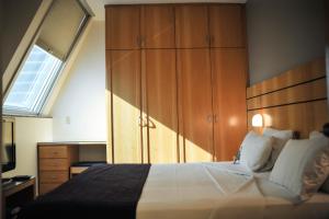 Cama ou camas em um quarto em San Diego Suítes Lourdes - OFICIAL