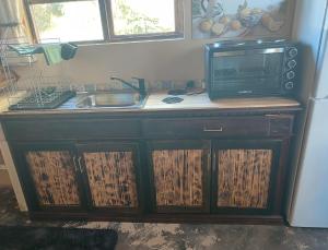 Η κουζίνα ή μικρή κουζίνα στο Acorn Cottage