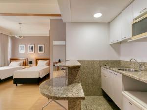 Cama ou camas em um quarto em Mercure Belo Horizonte Savassi