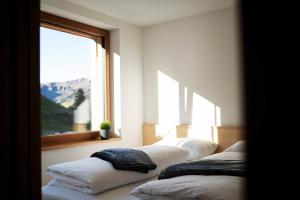 Postel nebo postele na pokoji v ubytování Berg Aparts - Top 6 - Faschina - mit Sauna & 2 Bädern