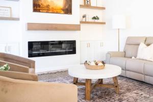 a living room with a couch and a table at Rustic Gold Retreat in Kanab