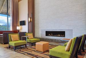 a lobby with a fireplace in a hotel room at Hampton Inn & Suites Silverthorne in Silverthorne