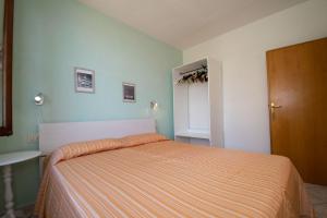 A bed or beds in a room at Appartamento Sergio