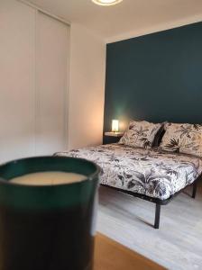a bedroom with a bed and a black wall at Maison de village avec exterieur in Lambesc