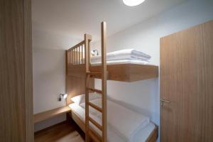 Postel nebo postele na pokoji v ubytování Faschina Apartment - Top 4