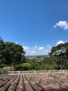 a view from the roof of a house with a white fence at La Farigoule in Aix-en-Provence