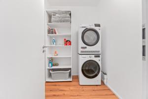 a laundry room with a washer and dryer at Golden Home with Barbecue, Yoga, Football Table in Sinsheim