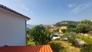 a view of a house with a red roof at Karmen in Kampor