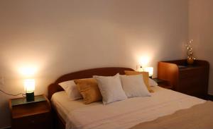 Кровать или кровати в номере Apartman Maslina
