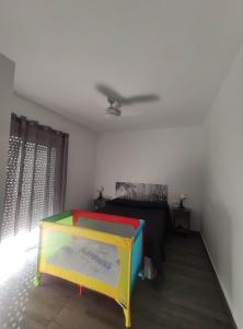 a room with a bed and a ceiling fan at Horrillo San José in San José