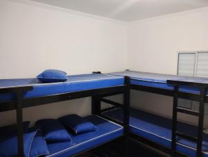 En eller flere senge i et værelse på Lar Pieri Rodrigues + 20 billeder