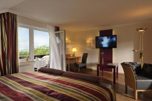 Ein Bett oder Betten in einem Zimmer der Unterkunft Landidyll Hotel Restaurant Birkenhof