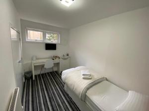Postel nebo postele na pokoji v ubytování Aaran Central Guesthouse