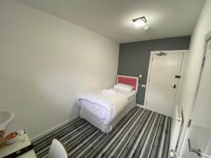 Postel nebo postele na pokoji v ubytování Aaran Central Guesthouse