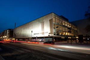 a building on the side of a street at night at WonderFlat for Wonderful people in Berlin