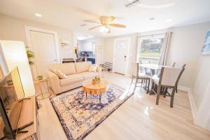 a living room with a couch and a table at Newly renovated Midtown Gem in Tyler