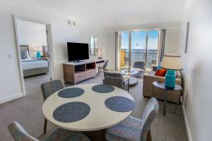 a living room with a table and chairs and a living room at The Atlantic Hotel & Spa in Fort Lauderdale