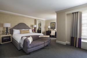 a hotel room with a bed and a couch at The Mayflower Hotel, Autograph Collection in Washington, D.C.