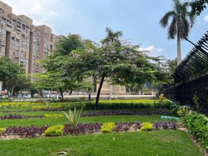 a garden in the middle of a city at European-Style Luxury Duplex on Maryland Park in Cairo