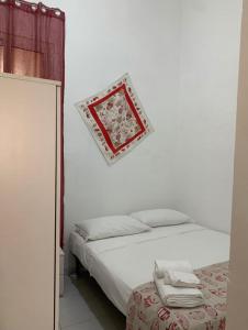 En eller flere senge i et værelse på La Casa di Giusy + 9 billeder