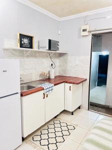 Kuchyň nebo kuchyňský kout v ubytování Decent Stay