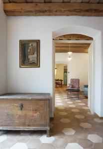 a living room with a wooden ceiling and a table at Old Town Flat with Private Patio in Kutná Hora