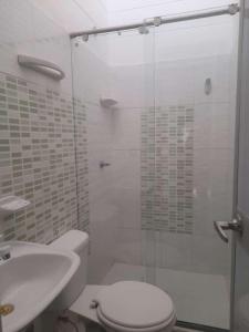a bathroom with a shower with a toilet and a sink at CASA AMOBLADA EN CONJUNTO CERRADO in Cúcuta