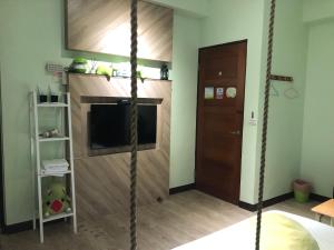 Postel nebo postele na pokoji v ubytování Ching Yu Rou B&B