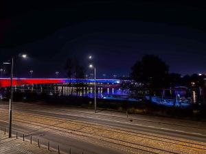 a city street at night with lights on the road at Loft Sava View Old Town Renovated in Belgrade