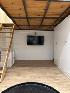 a room with a wooden ceiling and a staircase at ~{Le Pan’yay}~ in Marseille