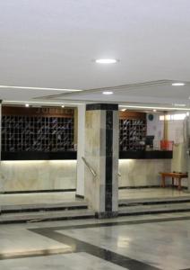 a lobby of a building with a bench in it at Jupiter Sea View in Benalmádena