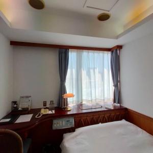 HOTEL POSH客房内的一张或多张床位