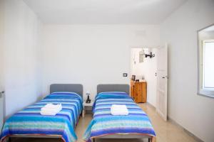 מיטה או מיטות בחדר ב-Casa Simone Campagnano di Roma