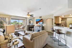 a living room with a couch and a table at Biltmore Bliss Desert Retreat! in Phoenix