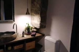 a bathroom with a sink and a toilet at Dream vacation on the lake in Brissago
