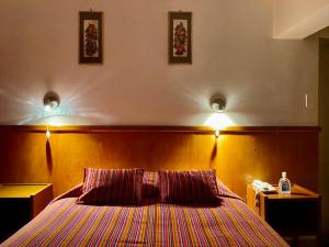 Rúm í herbergi á Saphi Inn Cusco - Excelente ubicación