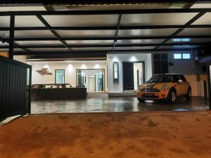 a car parked in a parking lot in a garage at Kulim Mini HomeStay in Kulim