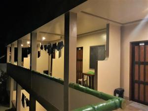 a view of a room with a staircase and mirrors at Ausan Beach Front Cottages in San Vicente