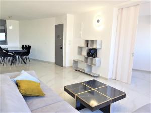 a living room with a couch and a table at 4bdrm - 110mr - Dream vacation apartment in Tiberias