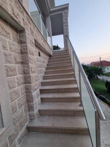 a set of stairs leading up to a building at Apartment Marijana in Tivat