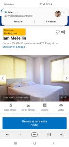 a page of a website with a bed in a bedroom at I am envigado. in Envigado