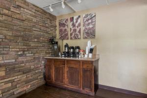 a brick wall with a counter in a room at Red Roof Inn Hickory in Hickory