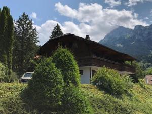 a house with a car parked in front of it at Chalet Bernex, 5 pièces, 10 personnes - FR-1-498-94 in Bernex