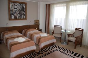 Posteľ alebo postele v izbe v ubytovaní Afrika Hotel Frýdek-Místek