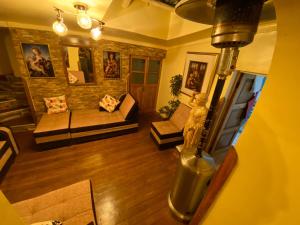 an overhead view of a living room with a couch at My Way GUEST HOUSE in Cusco