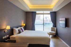 Postel nebo postele na pokoji v ubytování CHECK inn New Taipei LuZhou + 37 fotografií