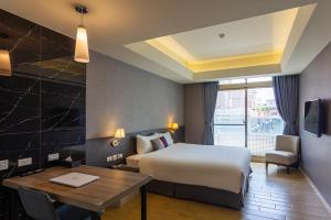 Postel nebo postele na pokoji v ubytování CHECK inn New Taipei LuZhou